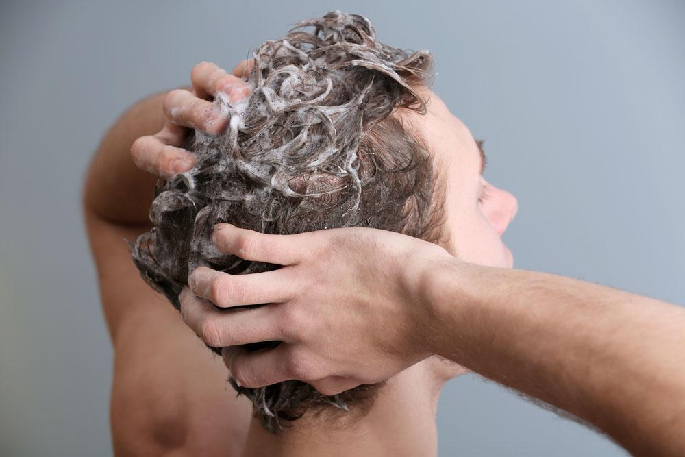 man-washing-hair